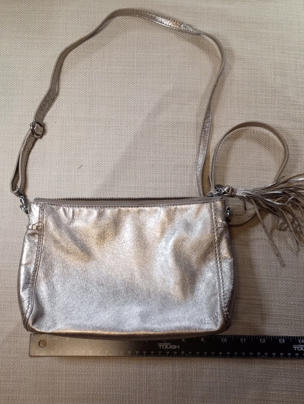 The Sak Metallic Silver Crossbody with Tassel Accent